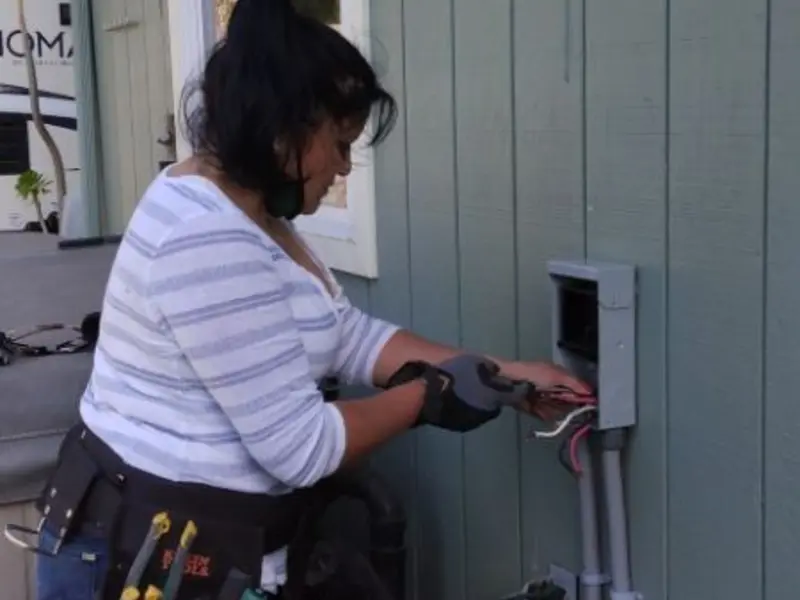 Licensed electrician wiring an exterior subpanel in Martinsville