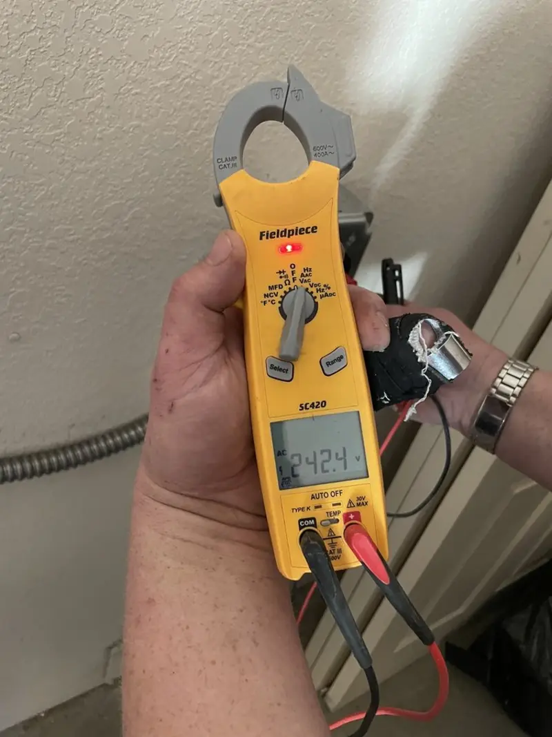 Voltage testing with clamp meter during Electrical Installation Services in Martinsville